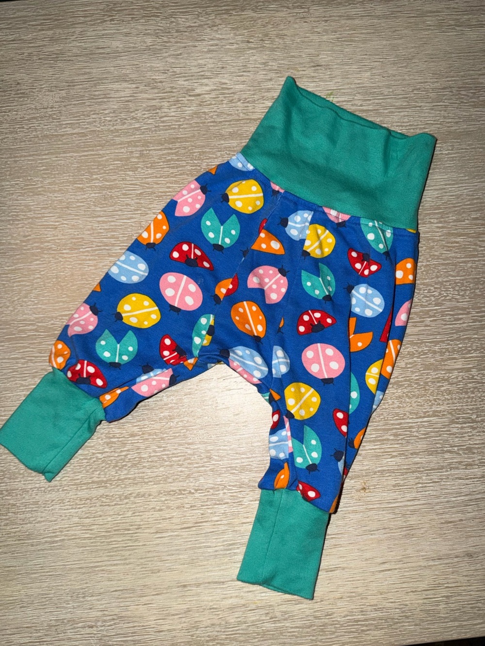 Frugi Parsnip Pants Ladybug Print size 6-9 months